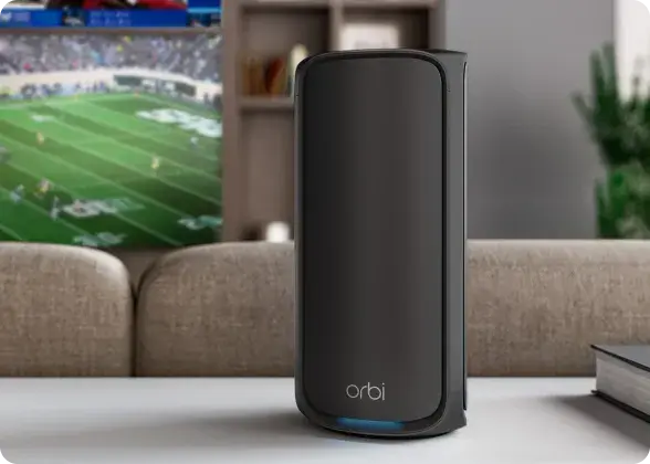 Black Orbi 970 router in a living room