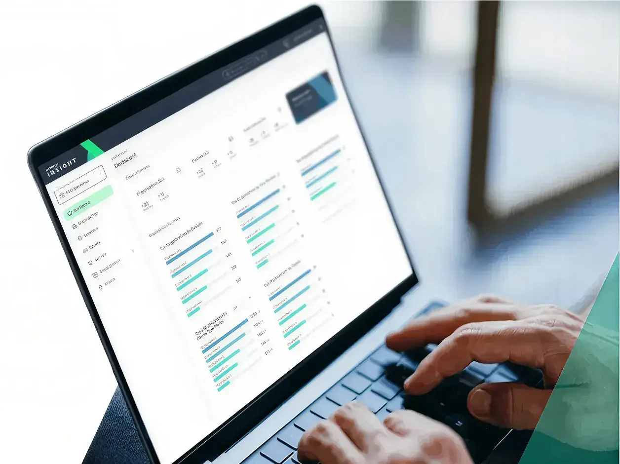 Person using NETGEAR Insight on a laptop to view a network dashboard