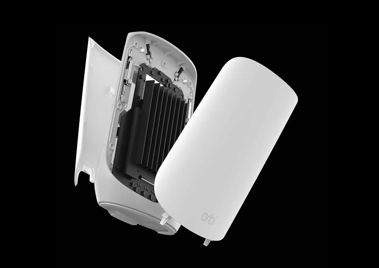 Exploded view of an Orbi router showing its internal components