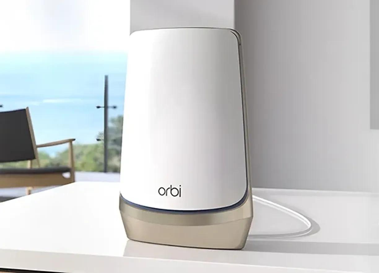 Orbi router on a table in a bright living room